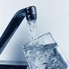 image of glass being filled from faucet